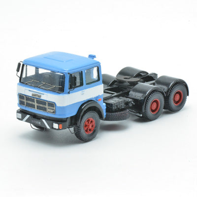 697 3-axle mounted light blue tractor truck with black chassis and white band