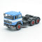 697 3-axle mounted light blue tractor truck with black chassis and white band