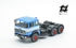 697 3-axle mounted light blue tractor truck with black chassis and white band