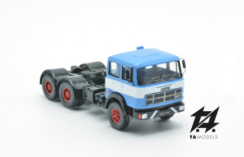 697 3-axle mounted light blue tractor truck with black chassis and white band