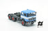 697 3-axle mounted light blue tractor truck with black chassis and white band