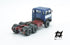 697 3-axle truck mounted on a blue tractor with a red chassis and white band