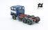 697 3-axle truck mounted on a blue tractor with a red chassis and white band