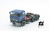 697 3-axle truck mounted on a blue tractor with a red chassis