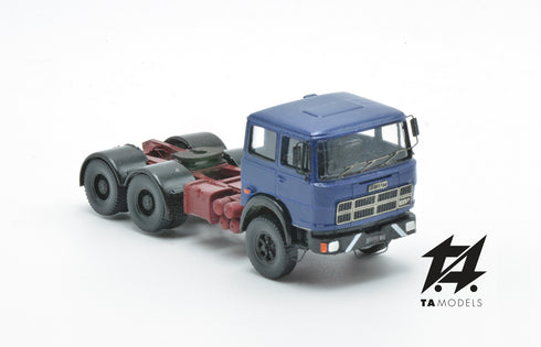 697 3-axle truck mounted on a blue tractor with a red chassis