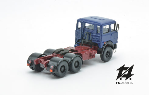 697 3-axle truck mounted on a blue tractor with a red chassis