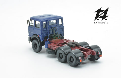 697 3-axle truck mounted on a blue tractor with a red chassis