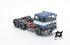 697 3-axle truck mounted on a blue tractor with a red chassis and white band
